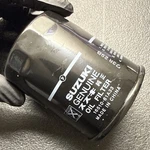 Suzuki Filter Assy,oil 16510-61A33 New. Price: $18.00.